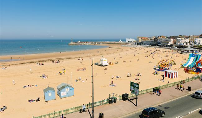 Margate Main Sands at high tide with promenade and arcades